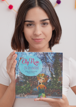 Load image into Gallery viewer, A bid sister proudly holding a new book she has just brought for her little sister. Elly Rose in Denmark written and illustrated by Maggie O'Hara