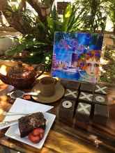 Load image into Gallery viewer, The Elly Rose Adventures-Selfies from Townsville written and illustrated by Maggie O'Hara spotted at a local cafe