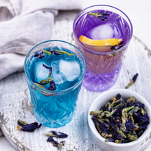 Load image into Gallery viewer, Two glasses of Fleur Tea, Blue Pea Flower tea. One glass of blue tea, one glass of purple tea.
